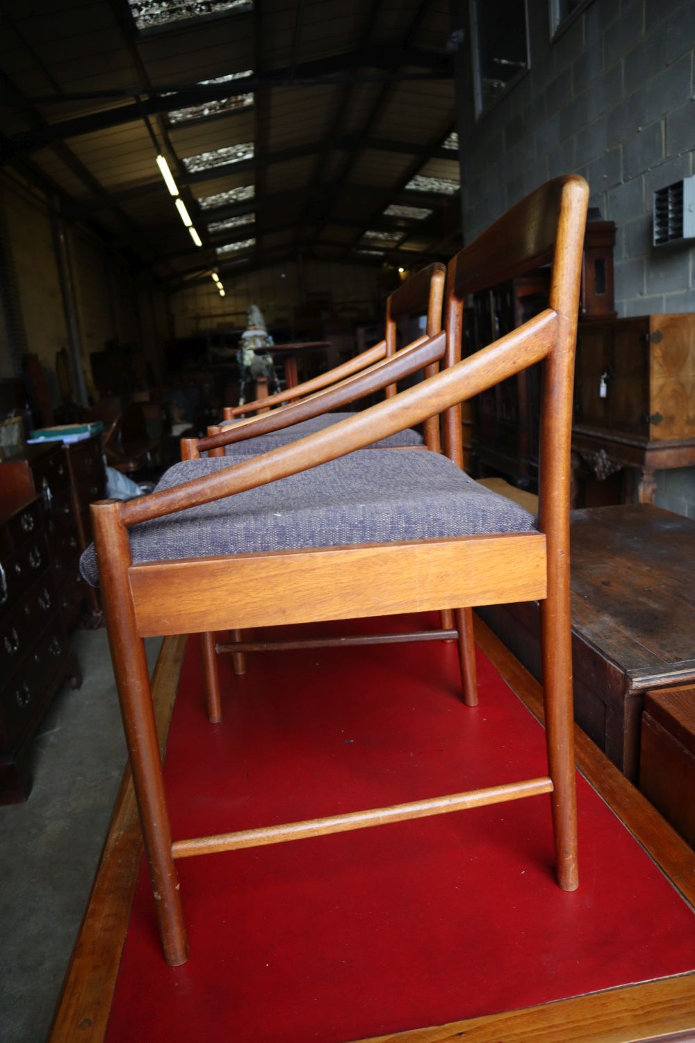 A set of four mid century Danish teak elbow chairs